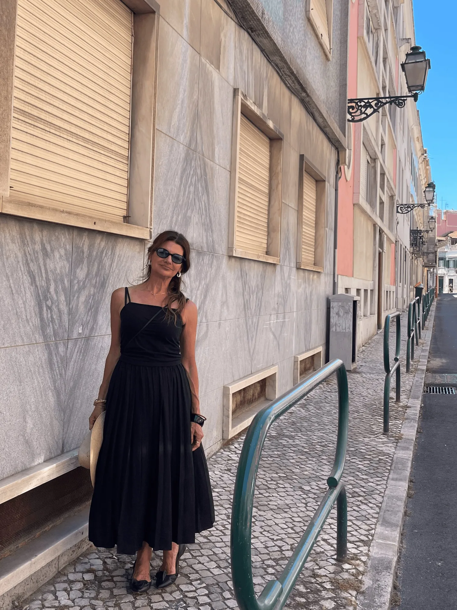 Carla Manuel in Lisbon in a black Kites dress