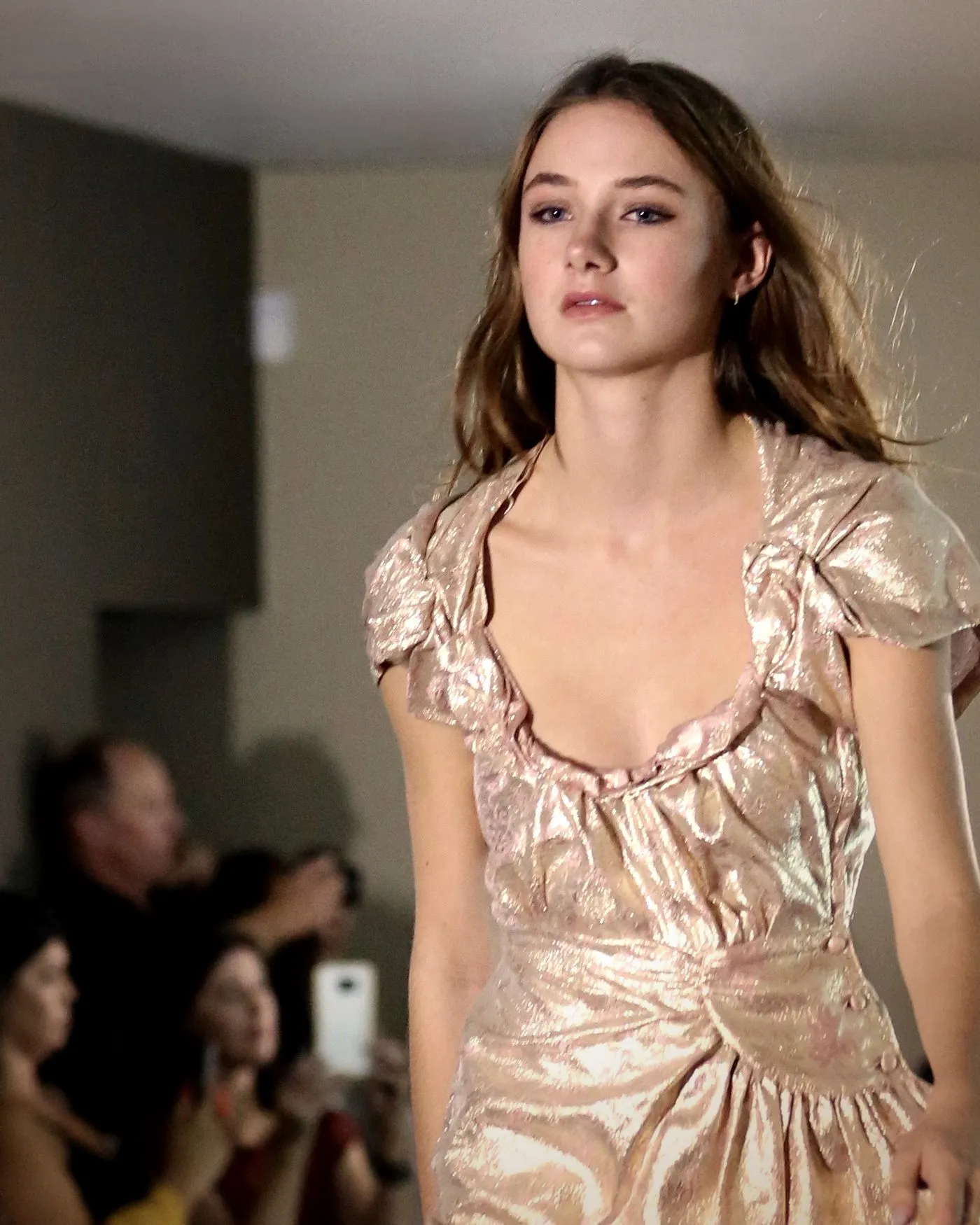 Gold lamé ruched dress on the runway