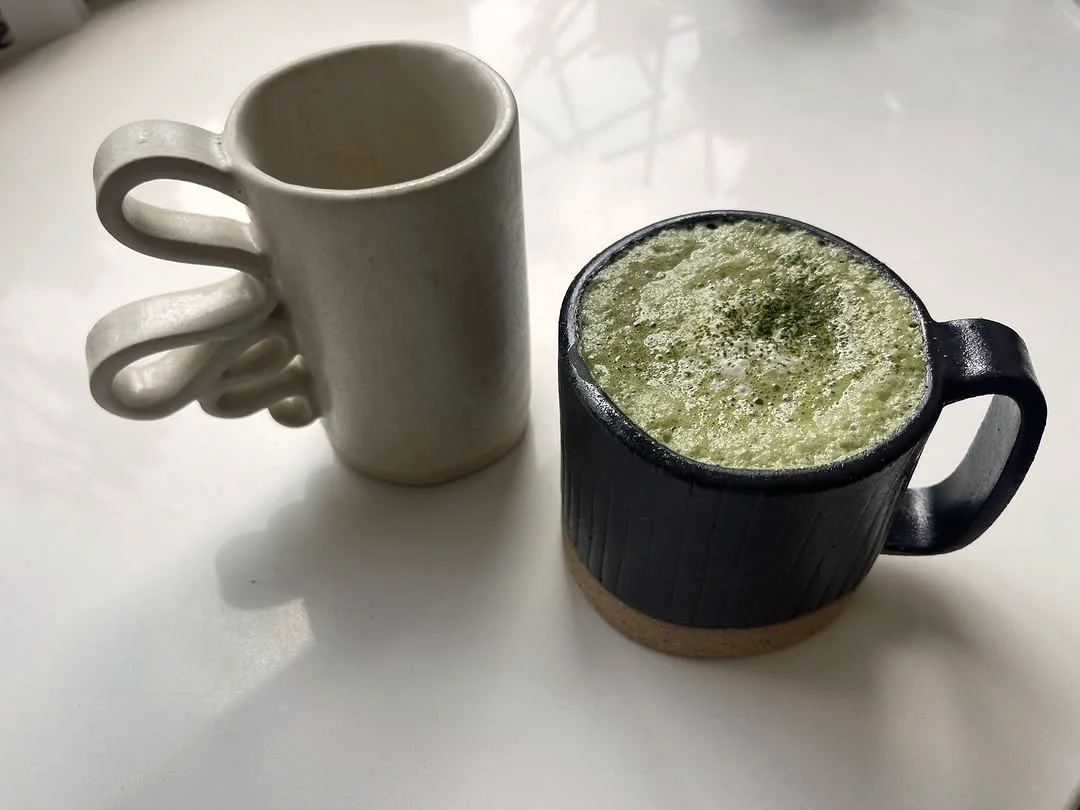 Ceramic mugs on the atelier table